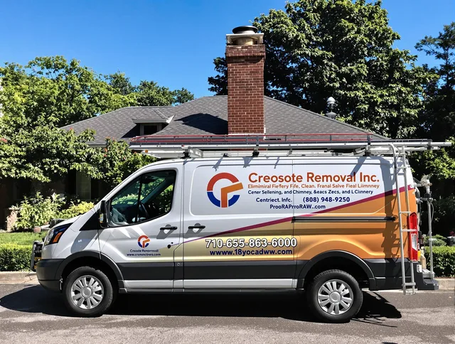 Groton Chimney Sweep technician removing creosote safely in Groton, MA