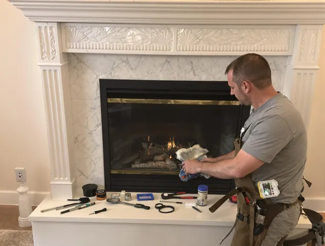 Groton Chimney Sweep performing fireplace maintenance in Groton, MA